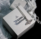 Minibas relief silver pendant