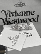 Minibas relief silver earrings