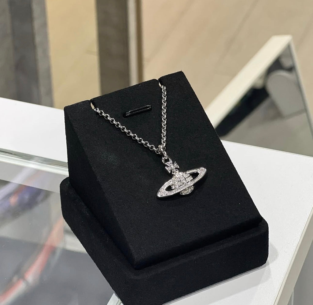 Minibas relief silver pendant